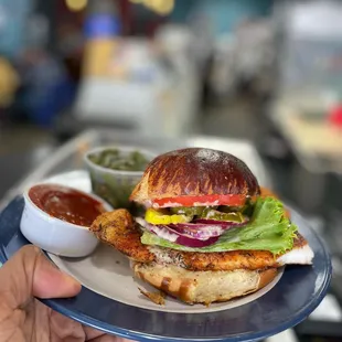 a chicken sandwich with lettuce and tomato