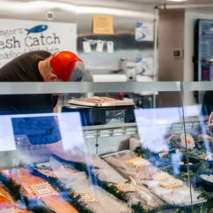 a man working in a fish shop