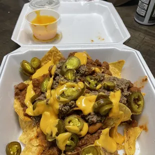 Nachos , Cheese, Meat, Chili and jalapeños! Mmm