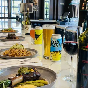 plates of food and a glass of wine