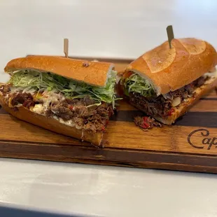 wo sandwiches on a cutting board