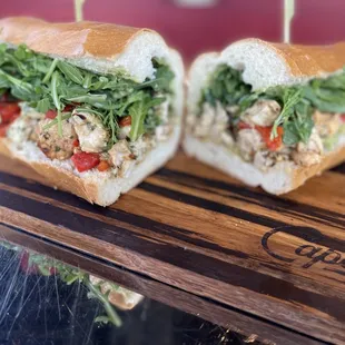 wo sandwiches on a cutting board