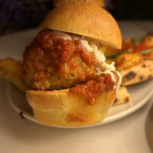 a meatball sandwich and french fries