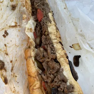 Cheesesteak with everything including peppers sweet and hot!