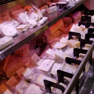 a display of cheeses and meats
