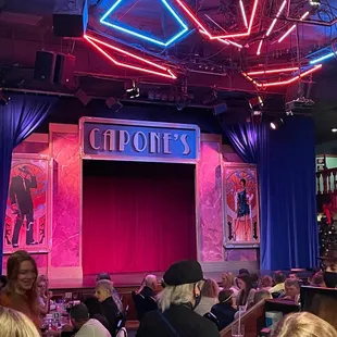 a crowd of people sitting at tables