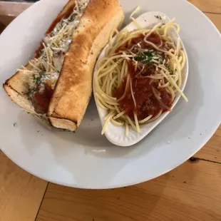 Meatball sandwich with a side of spaghetti