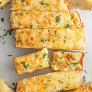 sliced bread with cheese and parsley