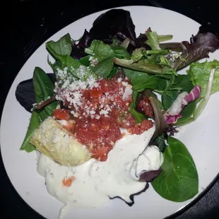 salad with tasty red sauce on top