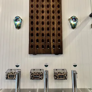 a row of wine bottles on a wall