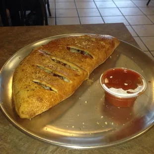 a piece of bread on a plate with ketchup