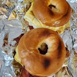 Bacon egg and cheese/sausage egg and cheese on plain bagels. (I did toast these to warm them up when I got home- hence the well done bagel)