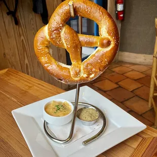 Pretzel with mustard and beer cheese