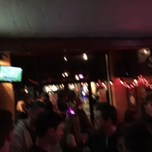 a crowd of people at a bar