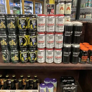 a shelf of cans of beer
