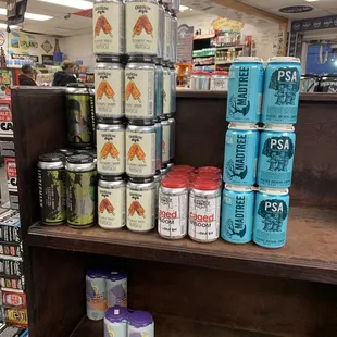 a shelf full of cans of beer