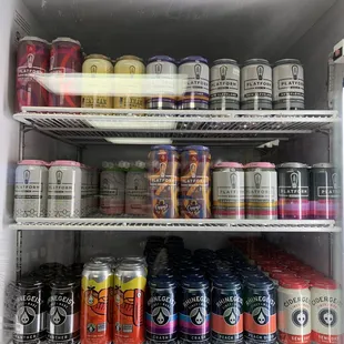 a refrigerator full of cans of beer