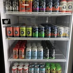a refrigerator full of cans of beer