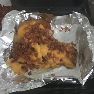 a piece of pizza in foil