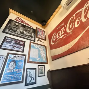 a coca cola sign on the wall
