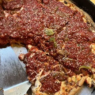 A large deep dish mid devouring