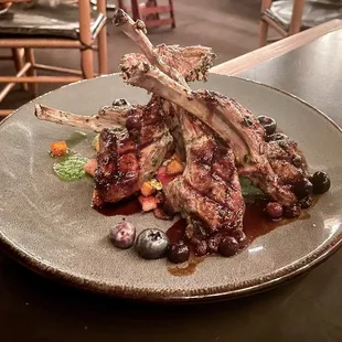 Rack of lamb special with blueberry demi and sautéed root veggies. Sorry for the dim lighting. I tried!