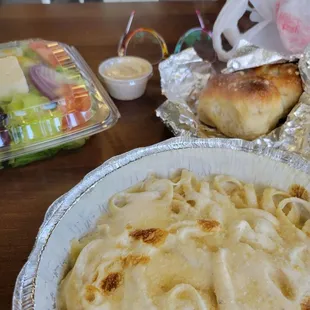 Greek salad, Fettuccine Alfredo, and wonderful garlic knots