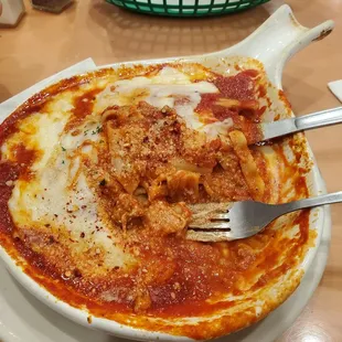 a plate of pizza and a fork