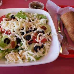 Tossed salad without onions, add cucumbers.  Home made Italian vinaigrette and bread on the side