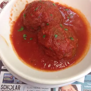two meatballs in tomato sauce