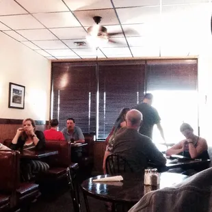 a group of people sitting at tables