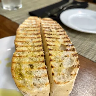 Warm bread with oil and I forgot what they add to this bread is delicious.  One bread is missing my son grabbed it before I snapped the pic