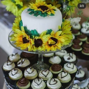 Wedding cake and cupcakes.