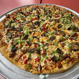 Extra large veggie pizza (substituded green peppers for black olives)