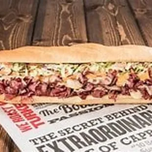 a sandwich on a newspaper