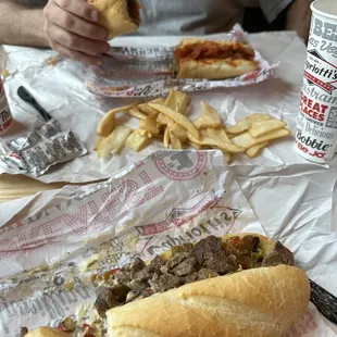 Classic cheesesteak &amp; Italian Sausage with flat fries.