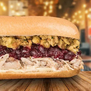 a turkey sandwich with cranberry sauce