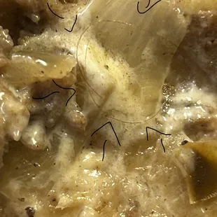 Hair.... Was stuck under the onion in the mayonnaise!