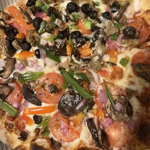 Half veggie, half combo pizza