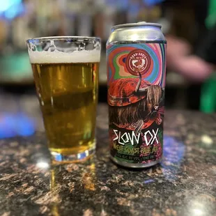 a can and a glass of beer
