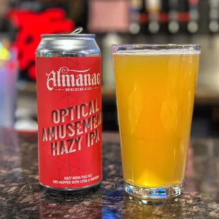a can and a glass of beer