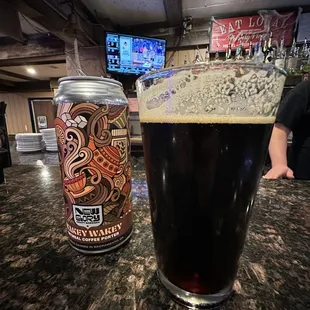 a can and a glass of beer