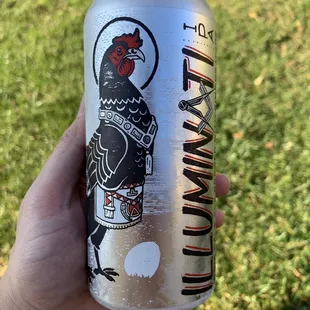 a hand holding a can