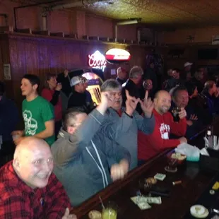 a crowd of people at a bar