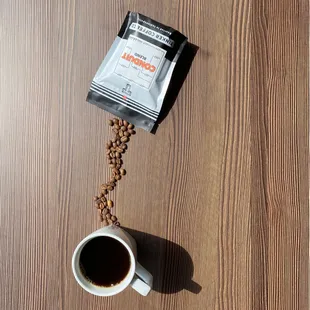Need coffee for home? Come grab a bag of Tinker's Conduit Blend whole-bean and a bottle of syrup to spice up your home coffee game.