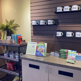 shelves of coffee mugs and books
