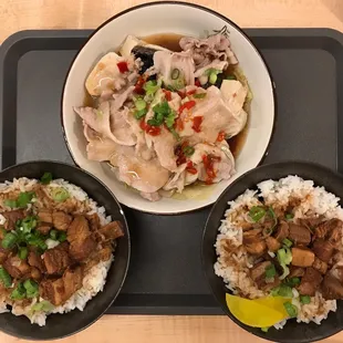 two bowls of food on a tray