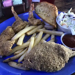 a plate of fried fish and french fries