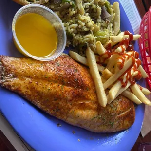 Blackened red snapper with rice.