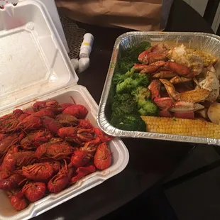 The Crawfish and Dungeness crab platter with red potatoes and broccoli.